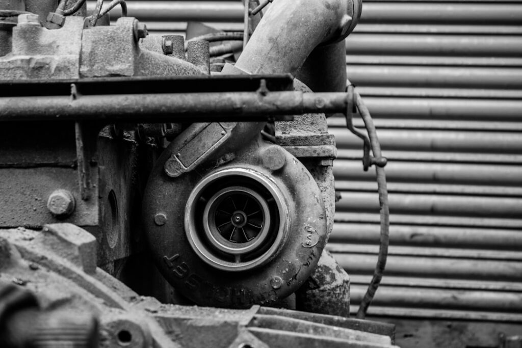 Diesel engine turbocharger cartridge on engine block — a high-failure-rate component under Gulf operating conditions