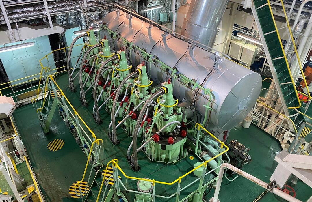 Commercial vessel main marine engine viewed from above in ship engine room