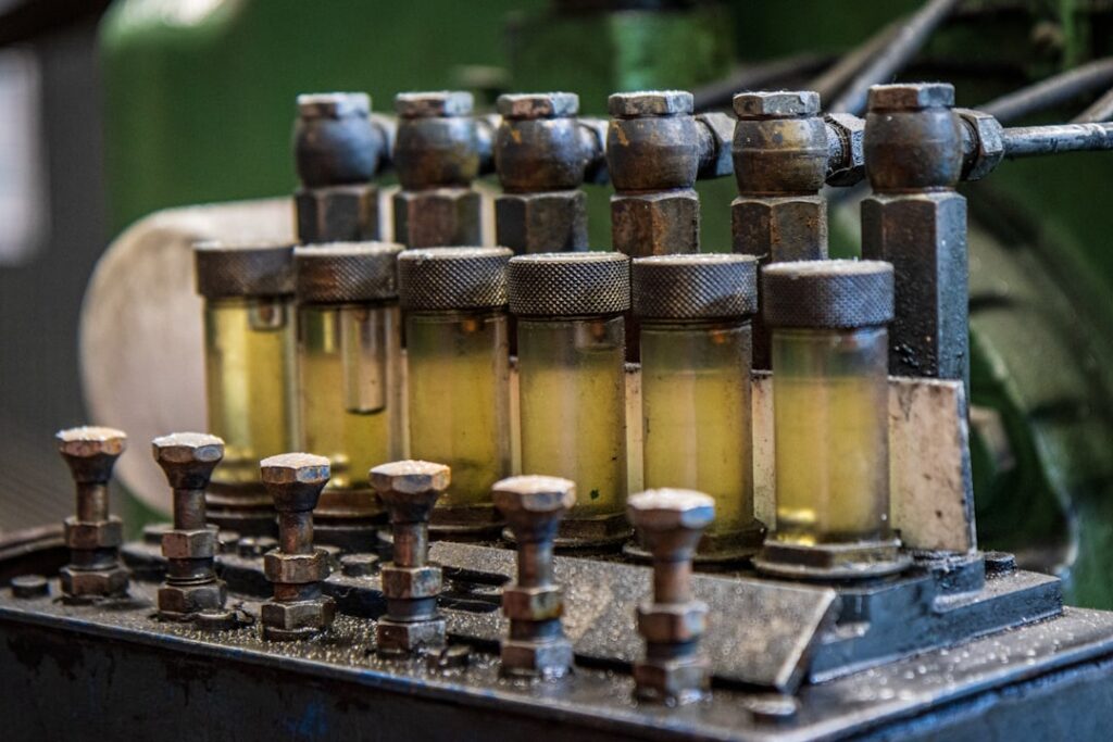 Diesel engine fuel injection components showing glass bowl sediment bowls and filter housings on a marine diesel engine.